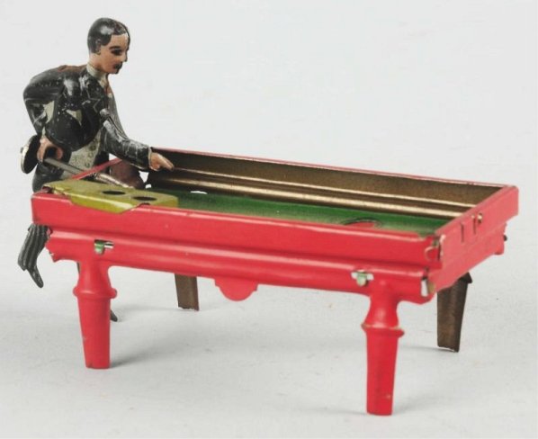 German Tin Litho Billiard Player Penny Toy.: Has one steel ball. Nice lithography. Spring loaded stick hits ball into holes. Some scratching and wear to figure. Condition (Very Good). Size 4" L.