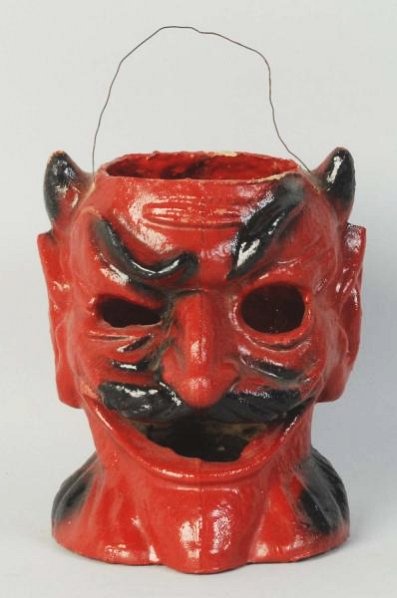 Devil Head Jack-O-Lantern.: No paper inserts. Condition (Excellent). Size 6 - 1/2" T.