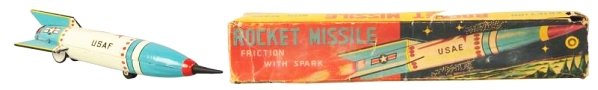 Tin Litho Friction Rocket Missle.: Made in Japan. Working. Includes original box. Some scratching throughout. Rubber tip is somewhat bent and factory touch up to several of the blue areas. Box has several areas of tears and tear repair
