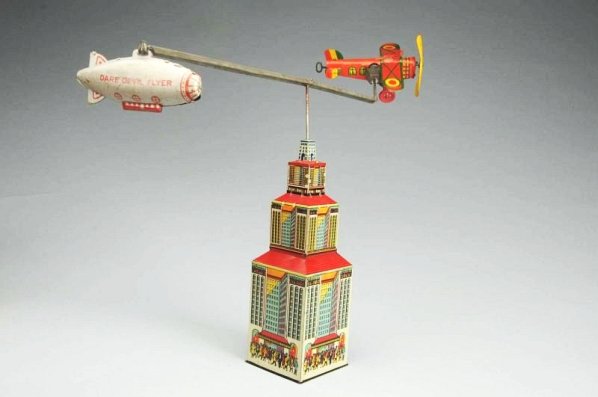 Marx Tin Litho Wind-up Dare-Devil Flyer Toy.: Comes with scarce colorful original box. Parts of the box are in pieces and will need to be put back together. Depicts wind up airplane and Zeppelin which rotate around a tower that looks like the Emp