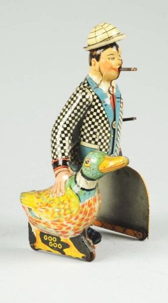 Marx TIn Litho Wind-up Joe Penner Toy.: Includes original box. Box does have some tearing, creasing, and tape throughout. Also has some laser copied flaps on box and one side of the box is also laser copied. Original hat. Depicts Joe Penner
