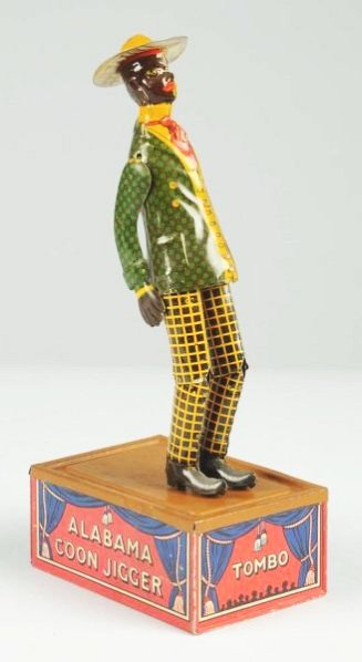 Strauss Tin Litho Wind-Up Tombo Dancing Toy.: Figure dances on roof when toy is in operation. All original arms. Brim of hat could be an early replacement. Some minor scratching and wear. Condition (Very Good - Excellent). Size 10" T.