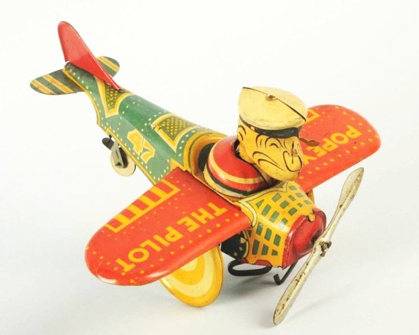 Marx Tin Wind-up Popeye The Pilot Airplane Toy.: Early version. Toy is all original including tail fin and prop. Toy does show significant play wear. Condition (Good - Very Good). Size 8" Wingspan.