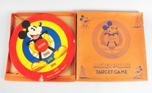 Walt Disney Mickey Mouse Target Game.: Marked "Walt E. Disney" on original box. Box does have some creasing and tearing at the side aprons. Colorful target shows Mickey standing in pose. Does have remnants of melted rubber dart stuck to bo