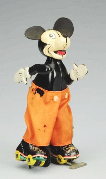 Linemar Tin Wind-up Mickey Mouse Skater Toy.: Toy has new rubber ears does have original pants with some tears to pants. Slight play wear. Condition (Very Good). Size 6 - 3/4" T.