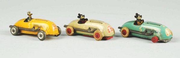 Lot of 3: Walt Disney Tin Litho Wind-up Race Cars: Made in USA. Includes two Mickey Mouse and one Donald Duck. All cars marked "No. 5". Donald Duck car has tin wheels and the other two have white rubber tires with red wooden hubs. One car missing rubb