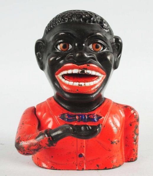 Cast Iron Jolly Mechanical Bank.: (3330-A). Black Face, Shepard Hardware Buffalo, New York. "Place a coin in the mans hand and press the lever; he raises his arm and swallows the coin as his eyes roll back and his tongue flips in." Te