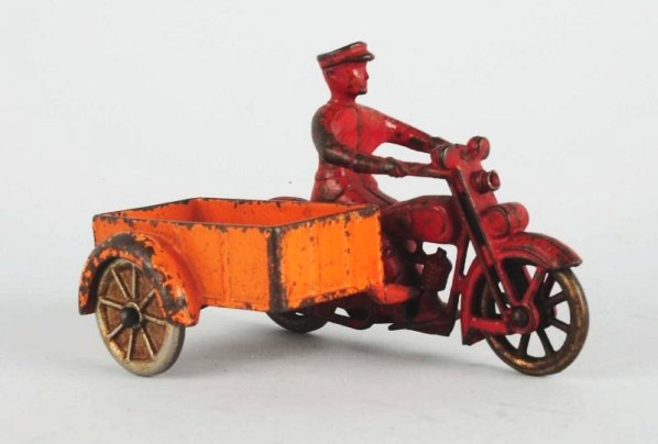 Cast Iron Kilgore Motorcycle & Side Cart.: Has original wheel noisemaker. Condition (Good - Very Good). Size 6" L. CORRECTION: Cracked at bar that joins cycle to sidecar.