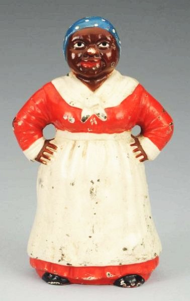 Cast Iron Mammy Doorstop.: Mammy with hands on hips. Hubley, full-figue. Condition (Excellent). Size 9" T.