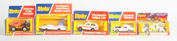 Lot of 5: Die Cast Dinky Vehicle Toys.: Includes No.221 Corvette Sting Ray, No.430 Johnston Dump truck, No.244 Plymouth Police car, No.674 Missile Launch Coast Guard and a No.361 Zygon war Chariot. Later packaging of boxes. Some rips to pla