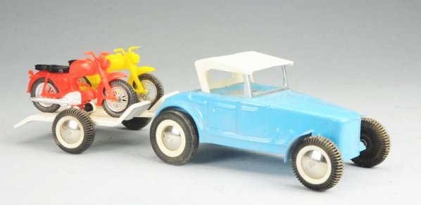 Buddy L Big H Race Team Set.: Pressed Steel hot rod car pulling a trailer with two motorcycles. Set appears to be in unused condition. Has two plastic Honda motorcycles. Comes in original box with insert. Condition (Near Mint). Si