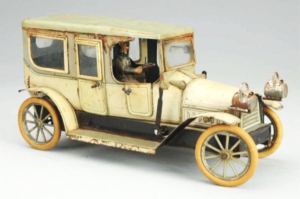 German Karl Bub KBN Clockwork Automobile.: Early glass windows, white rubber tires, looks to be original headlights on front and original tin litho driver. Car has spots of oxidation and some rusting plus scratching and paint loss especially o