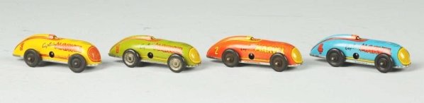 Tin Litho Captain Marvel Car Set.: Includes four different color racing cars. Made by Automatic Toy Co. All have identical flying captain marvel figures flying on sides and all say copyright 1947 Fawcett Publications Inc. A yellow, blu