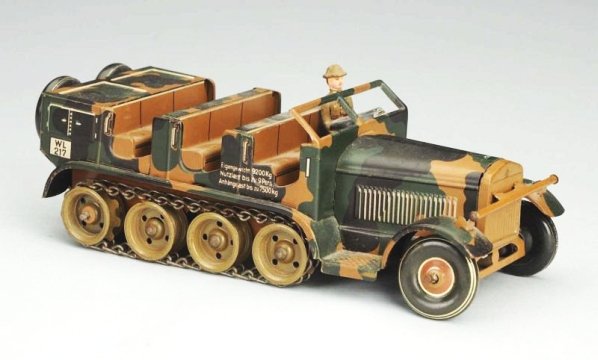 Tin Litho Wind-up Tippco Half Track Toy.: Has composition driver and spaces for other composition figures which are not present. Condition (Excellent). Size 8 - 1/2" L. CORRECTION: This is a Tippco toy, not Lionel.