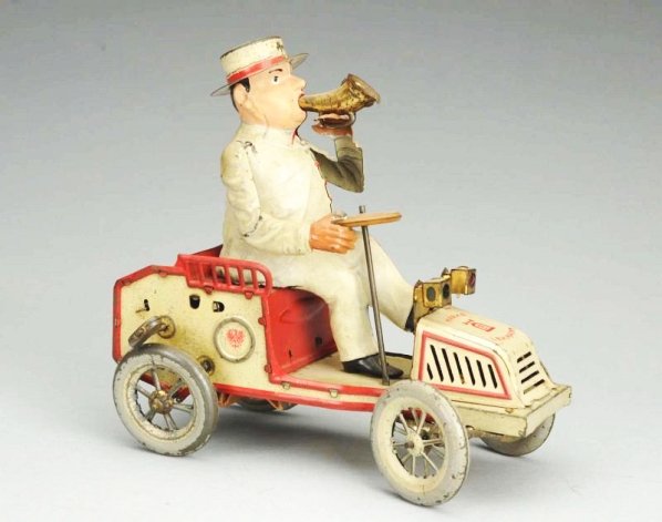 German Lehmann Tin Litho Wind-up Tut-tut Toy Car.: All original parts including the horn, hat, and front headlights. Some scratching and wear throughout, especially on the wheels. Condition (Very Good). Size 7" L.