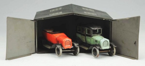 German Bing Garage with 2 Wind-up Autos.: Autos are tin litho. One is a sedan and one is a open roadster. Bing mark BW on back of garage. Garage does have some slight denting and scratching. Could clean to a better grade. Condition (Very Good