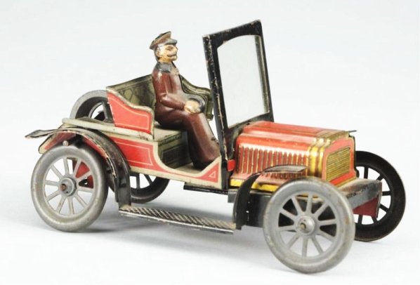 German Fly Wheel Open Automobile.: Car has original driver and windshield. Probably Carette. All original. Condition (Very Good). Size 6" L.