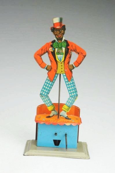 German Tin Litho Happy Jack Dancing Toy.: Made by KW. Figure and base both marked "Made in Germany". Depicts an African American man dancing on a small stage. Crank operated. Some minor to moderate scratching and wear especially to the back o
