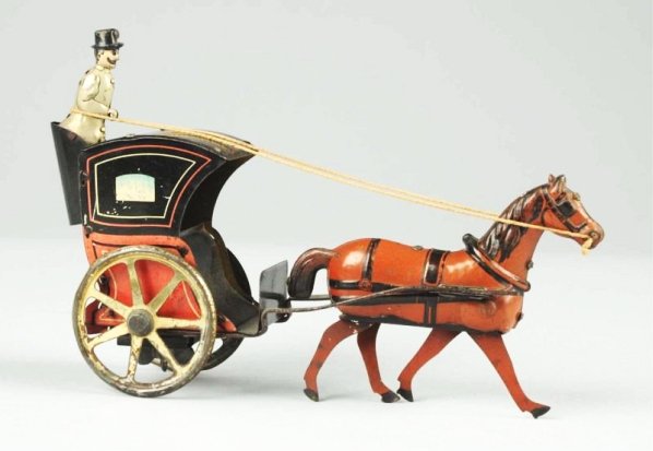 German Tin Litho Wind-up Cab Toy.: Unusual toy. Unmarked, but probably Hess. Tin litho driver in rear. Gold wash wheels that have some wear. Condition (Very Good - Excellent). Size 8 - 3/4" L.