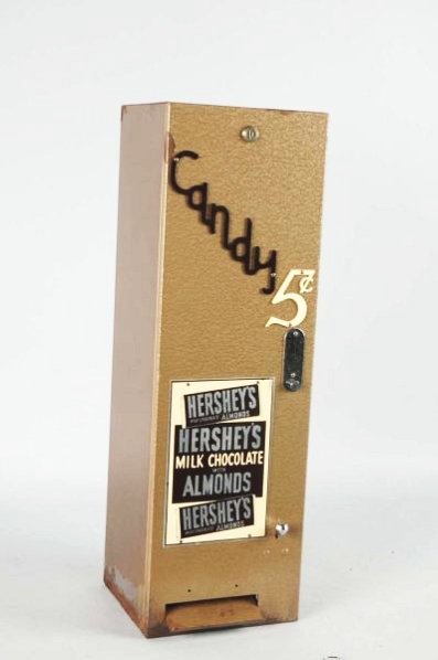 Hershey’s Chocolate 5 cent Vending Machine.: Circa 1950sand complete with key only very light wear and small rust spots mostly on the top of the item. Condition (Excellent). Size 28" T.