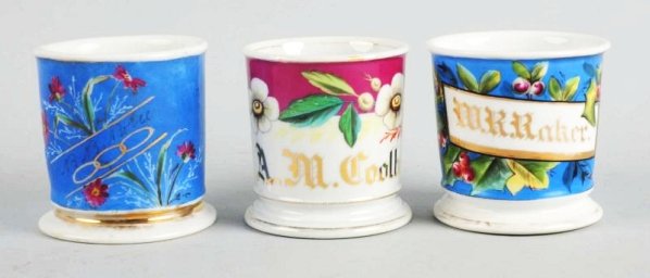 Lot of 3: Full-Wrap Floral Shaving Mugs.: Manufactured by Hyres B.R. Co Topeka, KS, & Koser Supplies in Philadelphia, PA. Boice Raker & Coolbaush in gold guild. No defects. Size Largest: 3 - 3/4" T.