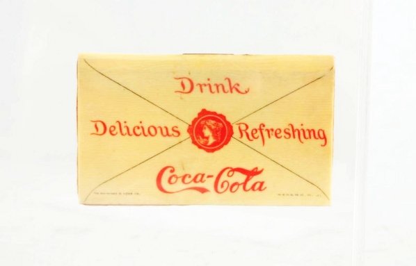 1900 Coca-Cola Celluloid Stamp Holder.: Only light wear and minor soiling or age toning. With a split on one side of the top fold at staple. Condition (Very Good). Size 2 - 1/2" L.