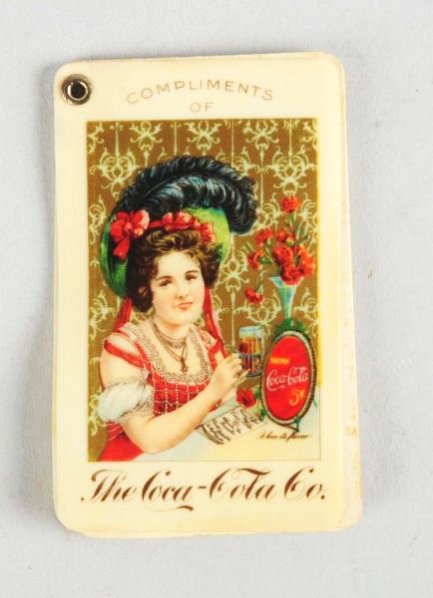1902 Coca-Cola Stamp Holder.: Clean and bright with very little wear a small bottom corner bend on back. Condition (Excellent). Size 2 - 1/2" L.