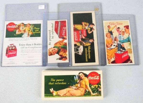 Lot of 21: Assorted Coca-Cola Blotters.: 1930s-1950s most are beautiful with no wear and a number of duplicates on the 1941 blotter with girl in garden. Condition (Excellent - Near Mint). Size Largest: 7 - 3/4" x 3 - 1/2".