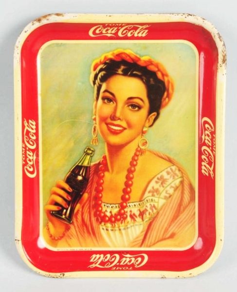 1940s Mexican Coca-Cola Tray.: Good color with a few scratches and corner sub-surface rust. Heavier edge wear, a small edge split, and touch-up in corner. Condition (Good - Very Good). Size 13 - 1/4" x 10 - 1/2".