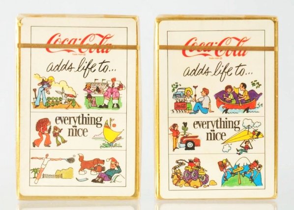 Lot of 2: 1976 Coca-Cola Card Decks.: Both unopened and still in original cellophane wrap. Condition (Near Mint Plus). Size Each: 3 - 1/2" x 2 - 1/4".