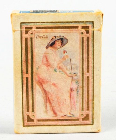 Scarce 1915 Coca-Cola Card Deck & Box.: The cards are like new with strong gold on the edges and includes the joker and instruction card and the promotional card. The box itself has some mild overall wear, soiling and bends. The cards are n