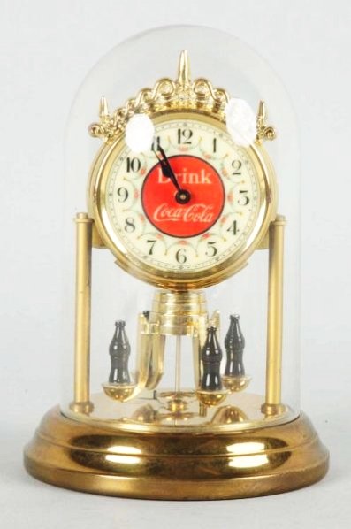 Small Coca-Cola Dome Clock.: 1940s-50s and made in Germany. Clean example, with just mild tarnish on the base. Condition (Excellent Plus). Size 5 - 3/4" T.