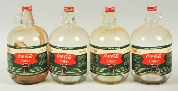 1960s Box with 4 One gallon Coca-Cola Syrup Jugs.: All have paper labels, with light wear, soiling, stains and tears. Condition (Very Good). Size 12 - 1/2" x 14" x 14".