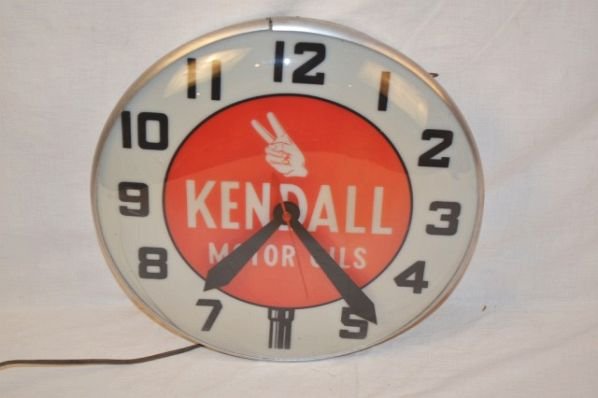 Kendall Motor Oil with Hand Logo Lighted Clock.: Clock works. Light does not work. Condition Rated 8.5. Size 15".