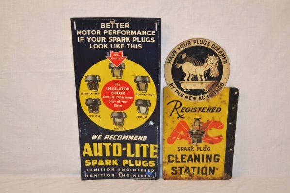 Lot of 2 Spark Plug Signs.: AC and Auto-Light Spark plugs. DST flange and SST. The flange on the AC sign has been straightened. It has rust and heavy wear the reverse side is only rated a 5 it has a lot more rust and wear. The A