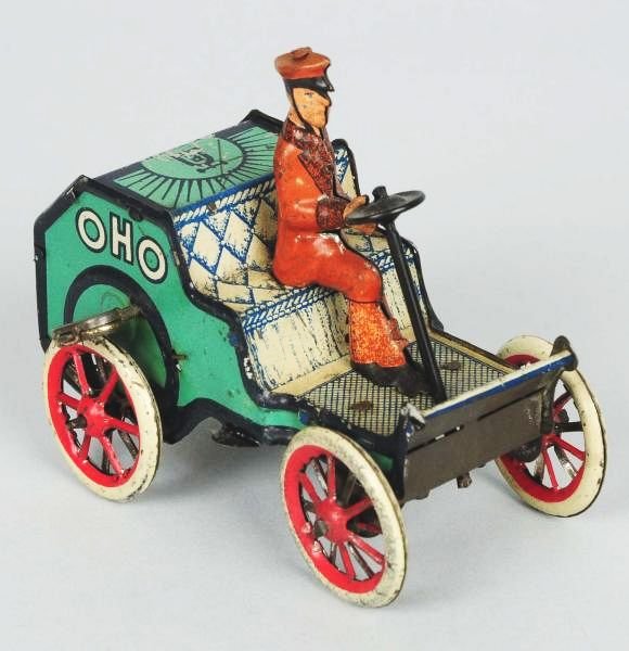 German Lehmann Tin Litho Wind-up OHO Auto Toy.: Marked "Made in Germany". Has Lehmann bellmark on back. Nice tin litho driver. Some scratching and litho loss. Condition (Very Good). Size 4" L.