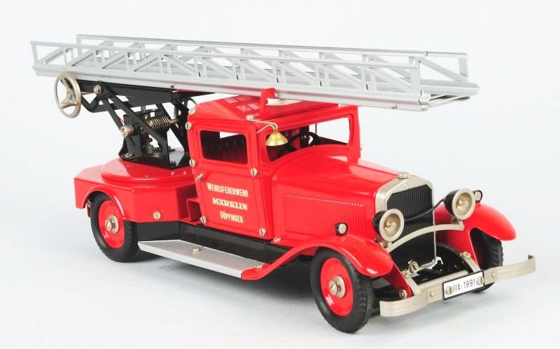 German Marklin Pressed Steel Fire Ladder Truck.: Contemporary. Includes two rear firemen. Very little wear. Condition (Excellent - Near Mint). Size 18" L.