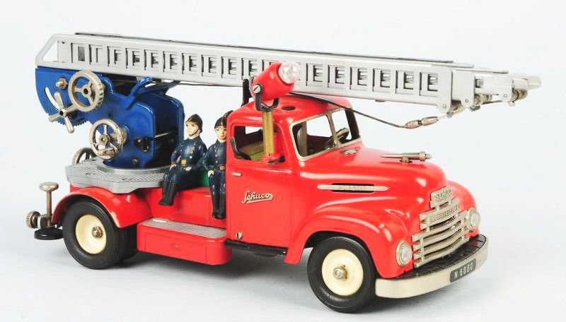 Schuco Tin Wind up Fire Ladder Truck.: Made in Western Germany. Toy is all original with nice detail. Has original spotlight. Condition (Excellent). Size 11 - 1/2" L.