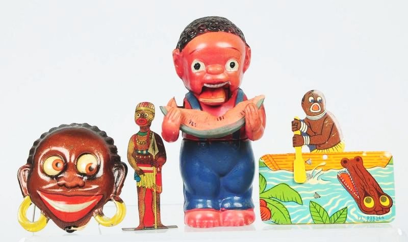 Lot of 3: Assorted Black Americanana Toys.: Boy eating watermelon. Made in Japan. Celluloid. Working. Black African clicker. Googly eyed woman works by pulling string. African tin figurine. Condition (Very Good). Size Largest: 4 - 3/4" T.