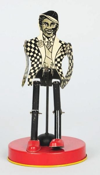 American Made Tin Litho Dancing Toy.: Depicts African American male in sport coat and hat dancing on tin base. Nice tin litho. Very little scratching and wear. Condition (Very Good - Excellent). Size 6 - 3/4" T.