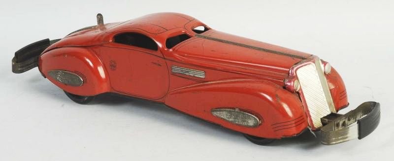 Marx Tin Litho Wind-up Reversible Coupe Toy Auto.: Original bumpers on front and back. Some scratching and wear with one dent to hood. Condition (Good - Very Good). Size 16 - 1/2" L.