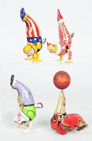 Lot of 4: Linemar & Chien Animal & Character Toys: Includes a Linemar Howdy Doody Clarabelle clown marked "Kagren Corp." on side. Also includes two Chien hand stand clowns. All are wind-up. The last is a chein seal with a wooden ball on top of his nos