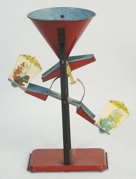 Early Popeye & Olive Oyl Sand Toy.: Two dimensional lithograph figures of Popeye and Olive Oyl on both sides of sand toy. Set up like a see-saw. Has been used. Has some pitting and wear. Condition (Very Good). Size 9 - 1/4" T.