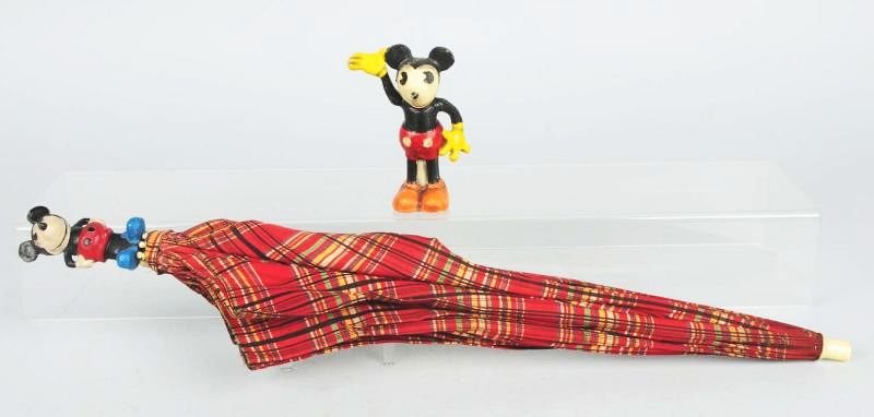 Mickey Mouse Umbrella & Composition Earlier.: Mickey Mouse umbrella. Circa 1930s. Definitely authorized. Mickey Mouse composition figure from train set. Looks like its had paint restoration. Circa 1930s. Condition (Good - Very Good). Size Largest