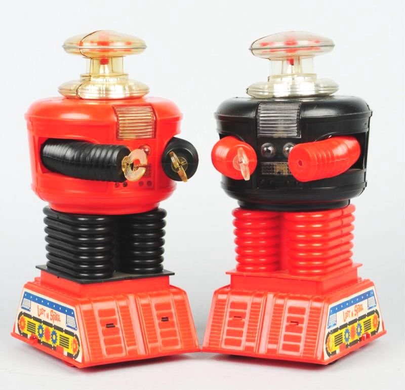 Lot of 2: Remco Lost in Space Robots.: Domes are loose on both robots and have some splitting. One robot is missing a hand. Condition (Very Good). Size Each: 12 - 1/2" T.