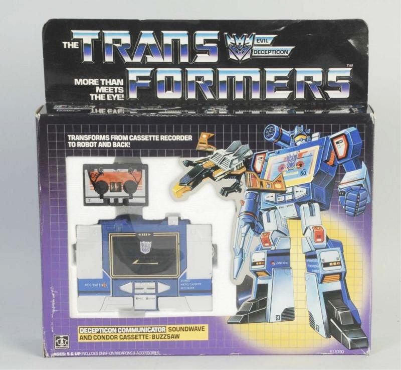 Hasbro Transformer Toy Robot.: Includes original box. Box does have some creasing and edge wear. Circa 1980s. Marked "Evil Deception". Condition (Very Good - Excellent). Size Box: 10" L.