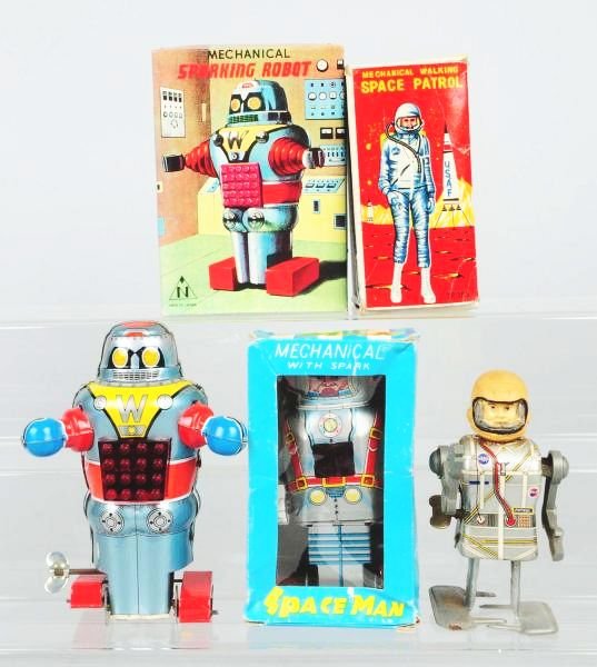 Lot of 3: Vintage Robot & Space Toys.: Including a mechanical Sparkling robot, a mechanical Spaceman and a mechanical Walking Space Patrol. All three pieces are in original boxes. Some creasing and tearing to the boxes. Condition (Excellen
