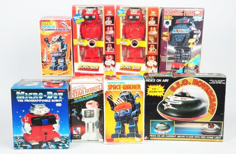 Lot of 8: Contemporary Robot & Space Toys.: Includes a Shooting Space Walker, a Musical Star Robot, a Microbot a UFO Hovercraft and others. All pieces are in original boxes. Some creasing to boxes. Condition (Near Mint). Size Largest Box: 13" T