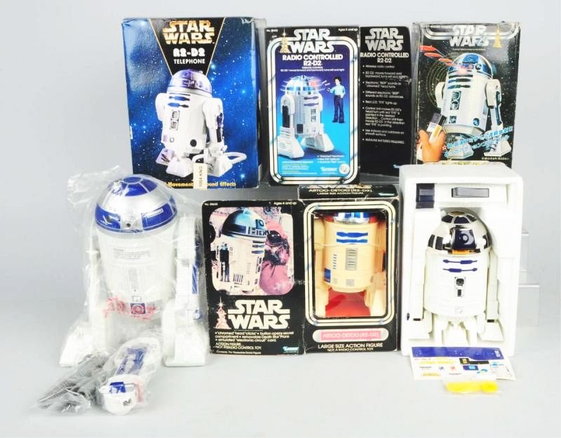 Lot of 4: Star Wars R2-D2 Robot Toys.: All in original boxes. Boxes do have some creasing and wear. Condition (Very Good). Size Largest Box: 12 - 1/2" L.