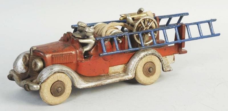 Vintage Cast Iron Hubley Fire Truck.: Toy has original drivers. Does have replacement ladders. Some scratching and wear throughout. Condition (Very Good). Size 9 - 3/4" L.